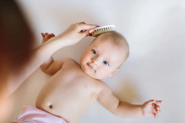 Mother brushed her child 4 months special brush.